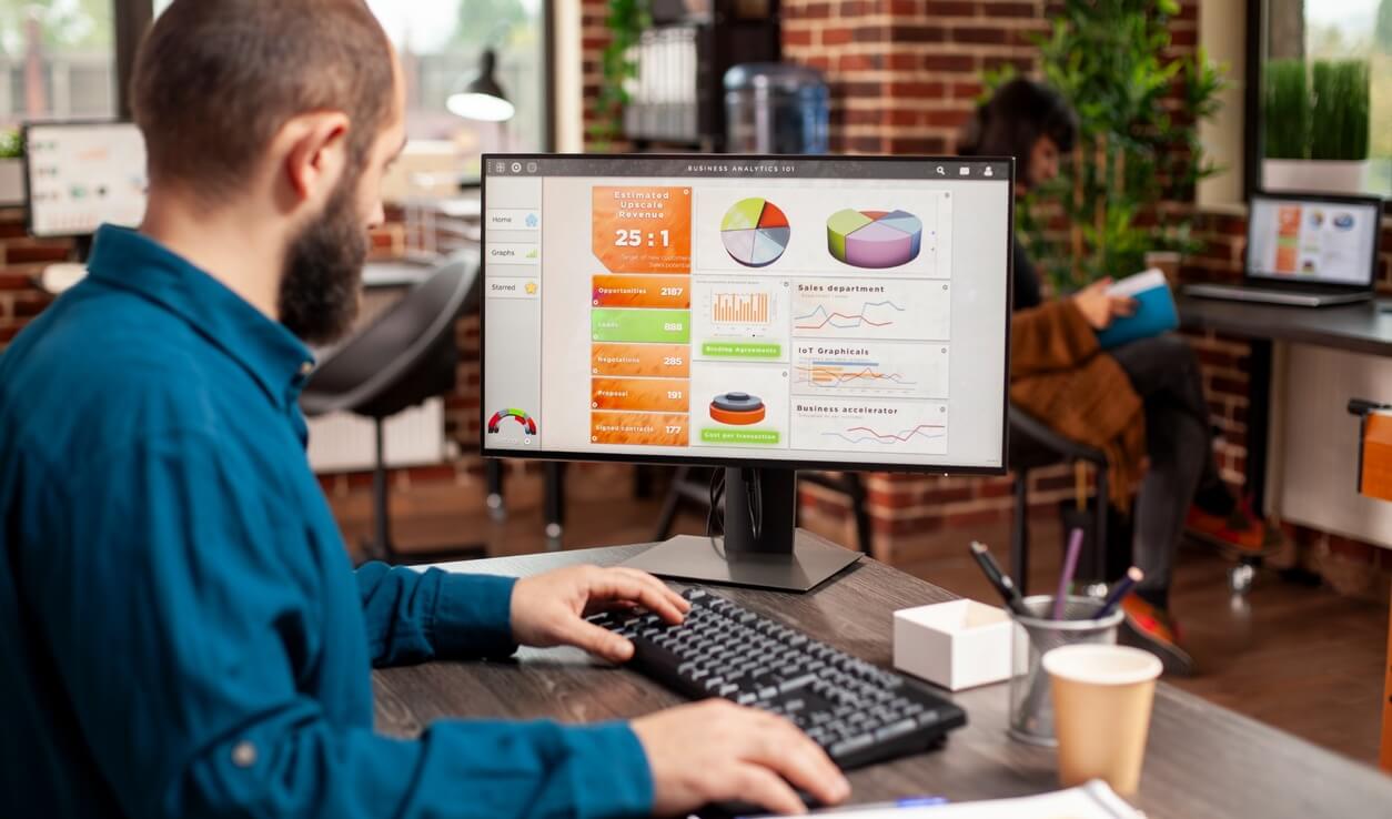 man analyzes business data 1254x738 1